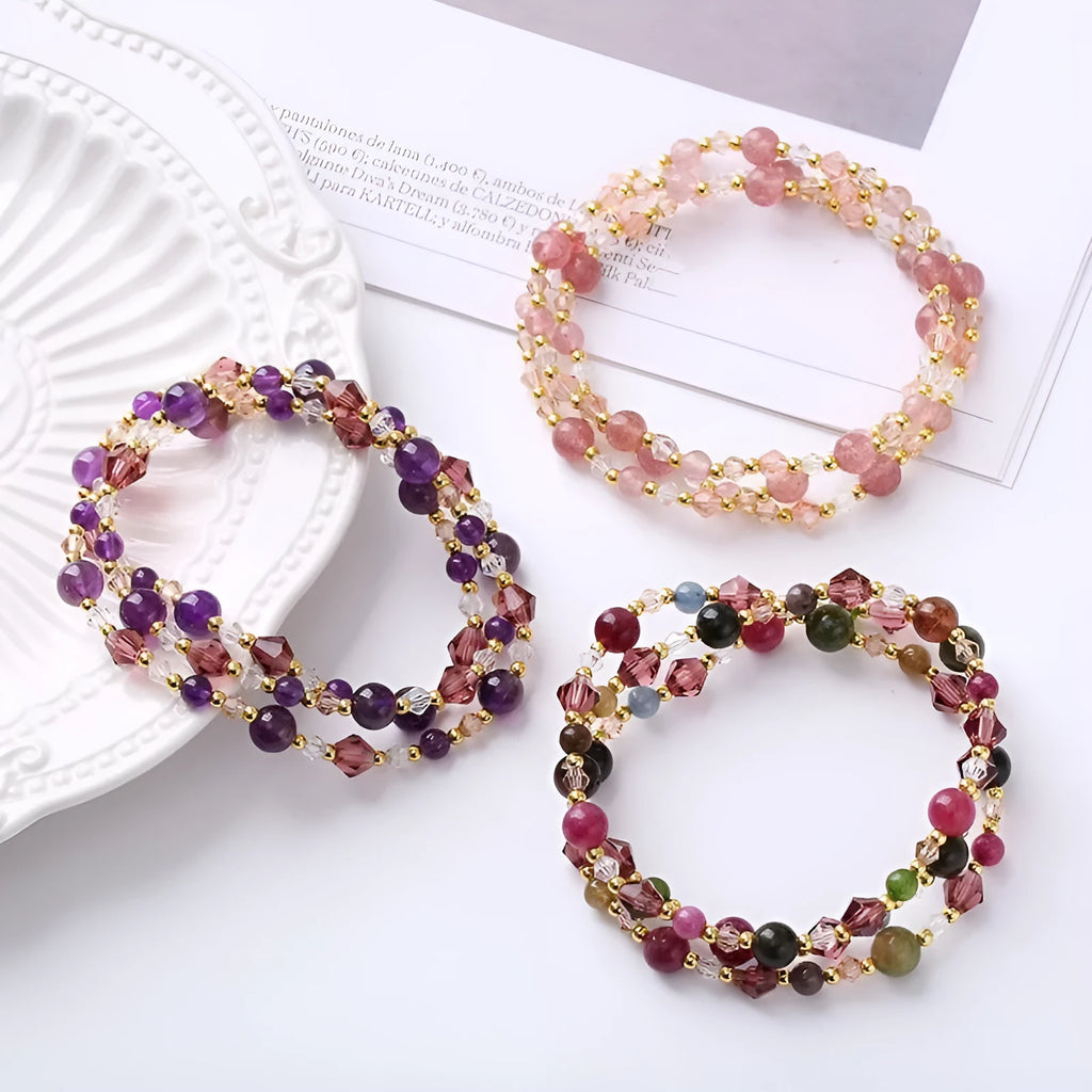 Colourful three-ring crystal bracelet for women with amethyst, strawberry quartz, and tourmaline beads on an adjustable rope.