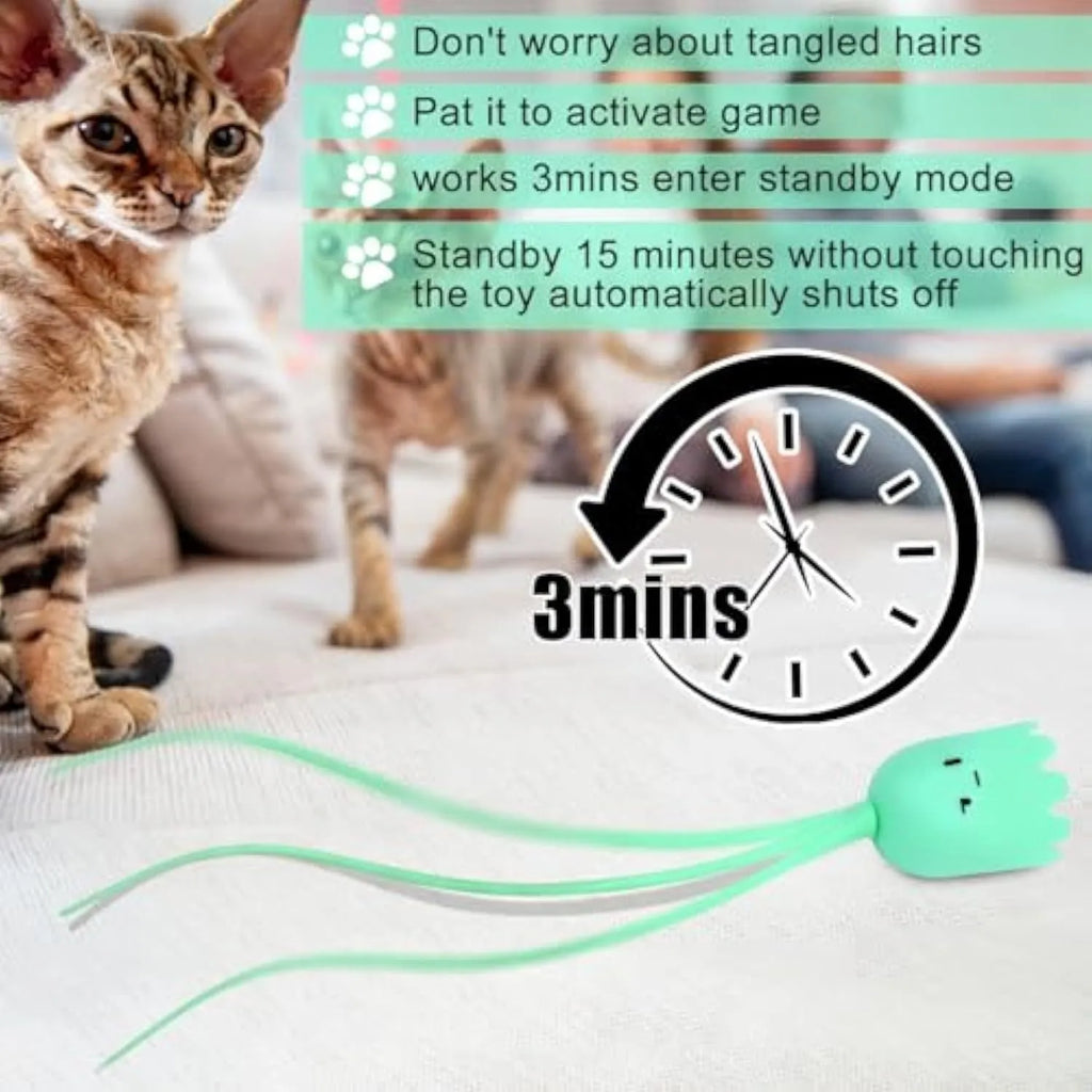 Green automatic cat wand toy with silicone tail on floor for indoor cat play
