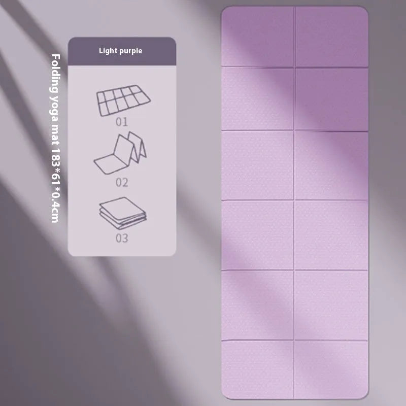 A folded and unfolded purple TPE gymnastic mat on a wooden floor.
