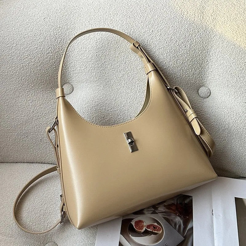 Genuine leather dumpling-shaped crossbody shoulder bag in apricot colour with street-trend details.