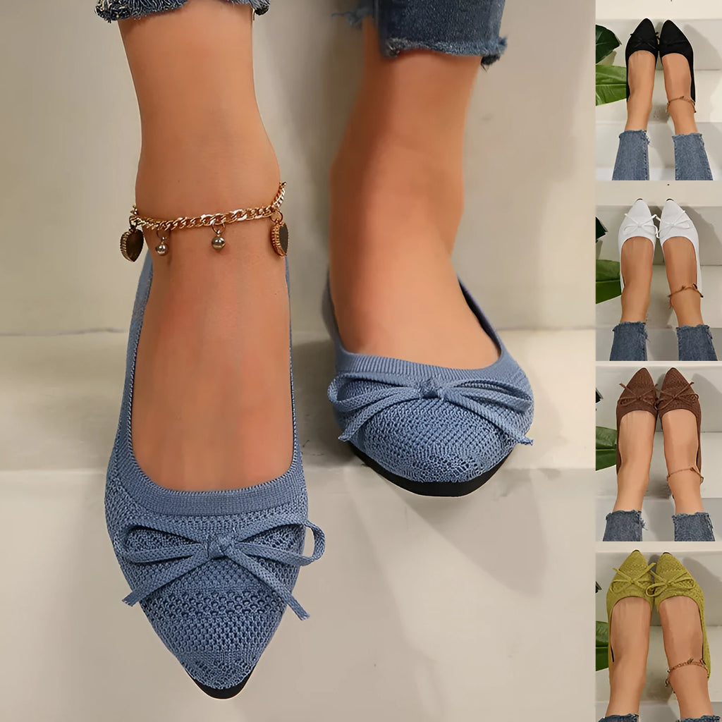 Women's knitted loafers with bow decoration in various colours showing flat rubber soles