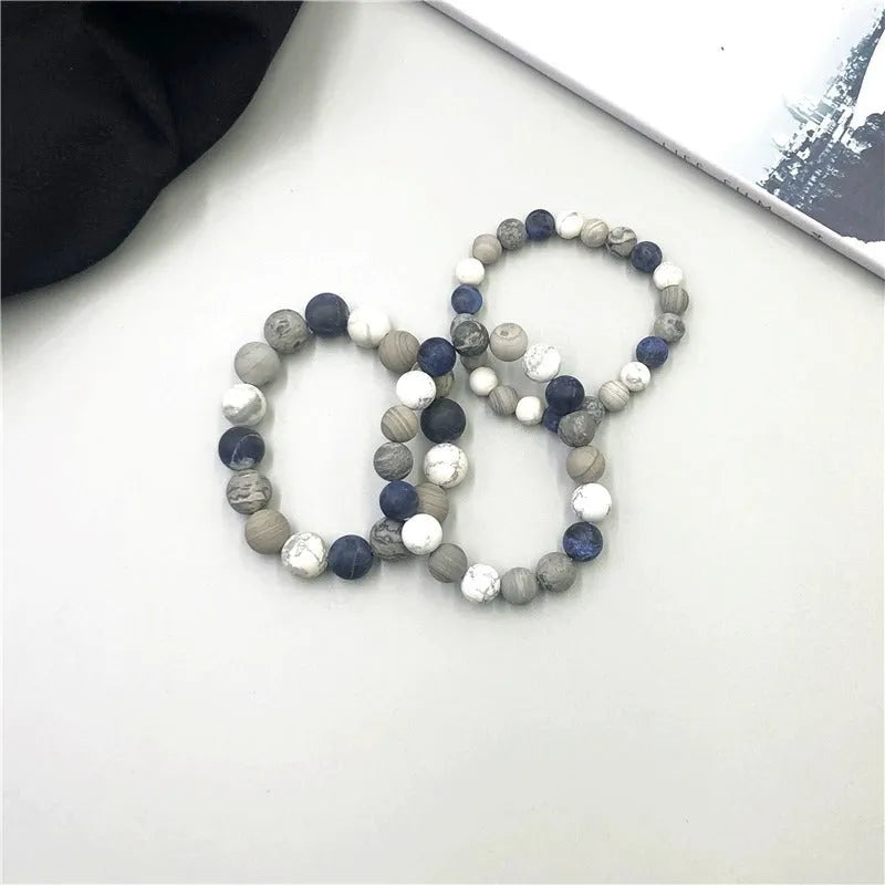 Handmade unisex U-shaped bracelet with natural planet stone beads in 8mm, 10mm, or 12mm sizes.