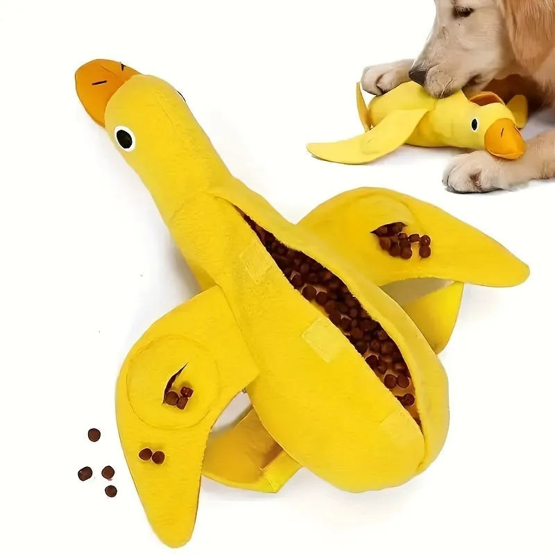 Yellow plush teddy bear dog toy with an attached duck doll, featuring a squeaker and treat compartment.