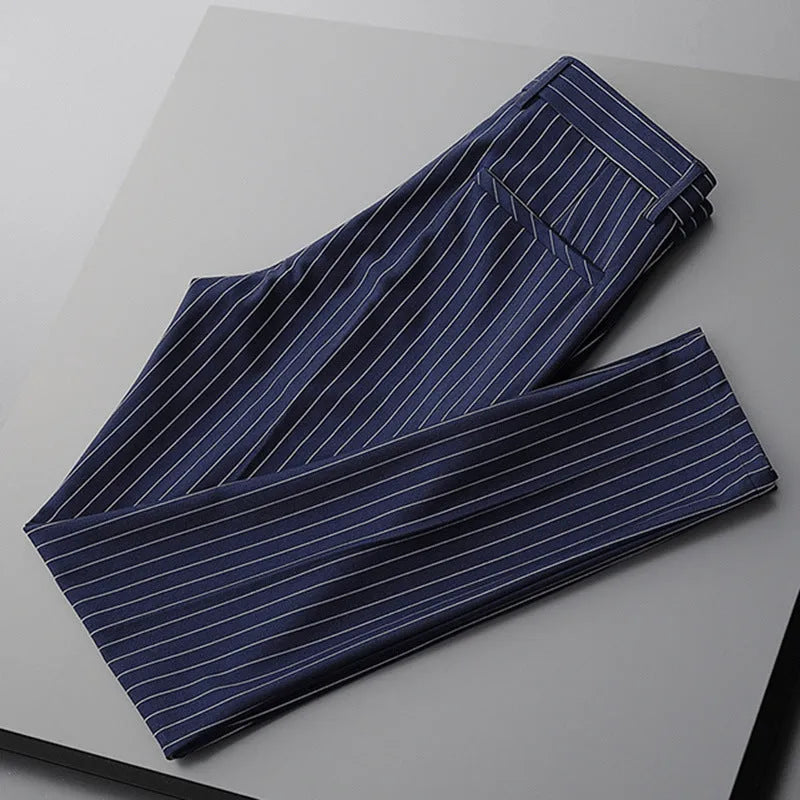 Men's loose-fitting striped casual trousers in black and white colours showing trousers and crop jeans styles