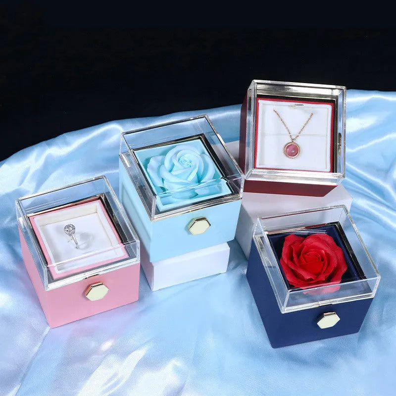 Rotating rose jewellery gift box with preserved real flower under acrylic cover and rotating drawer