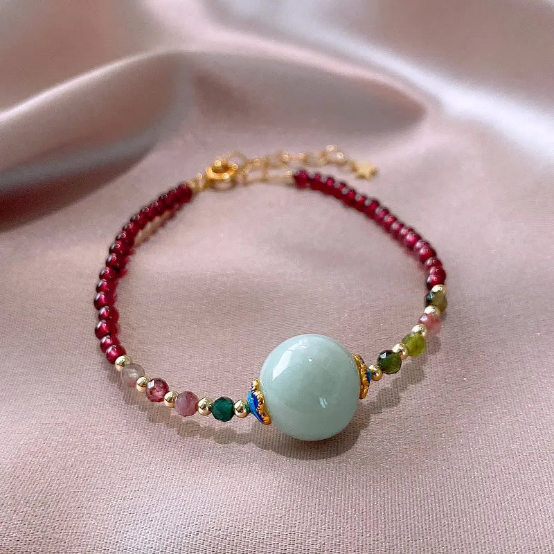 Aquamarine Chinese style garnet coloured tourmaline bracelet with a drop shape.