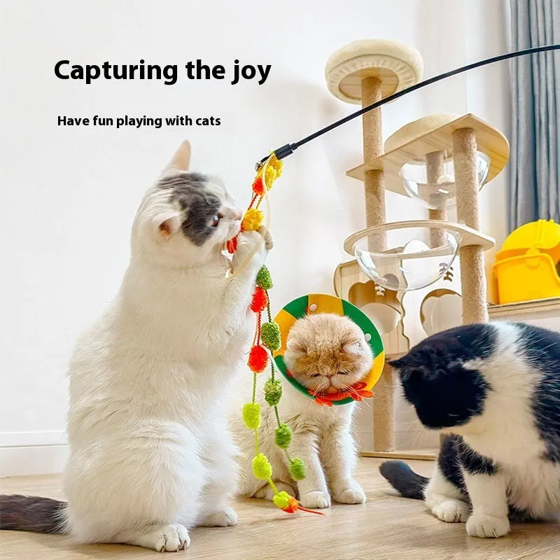 Rainbow cotton candy coloured cat teaser wand with bell, tassel, and plush ball