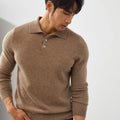 Man wearing a sapphire blue loose-fit cashmere pullover sweater with a polo collar.