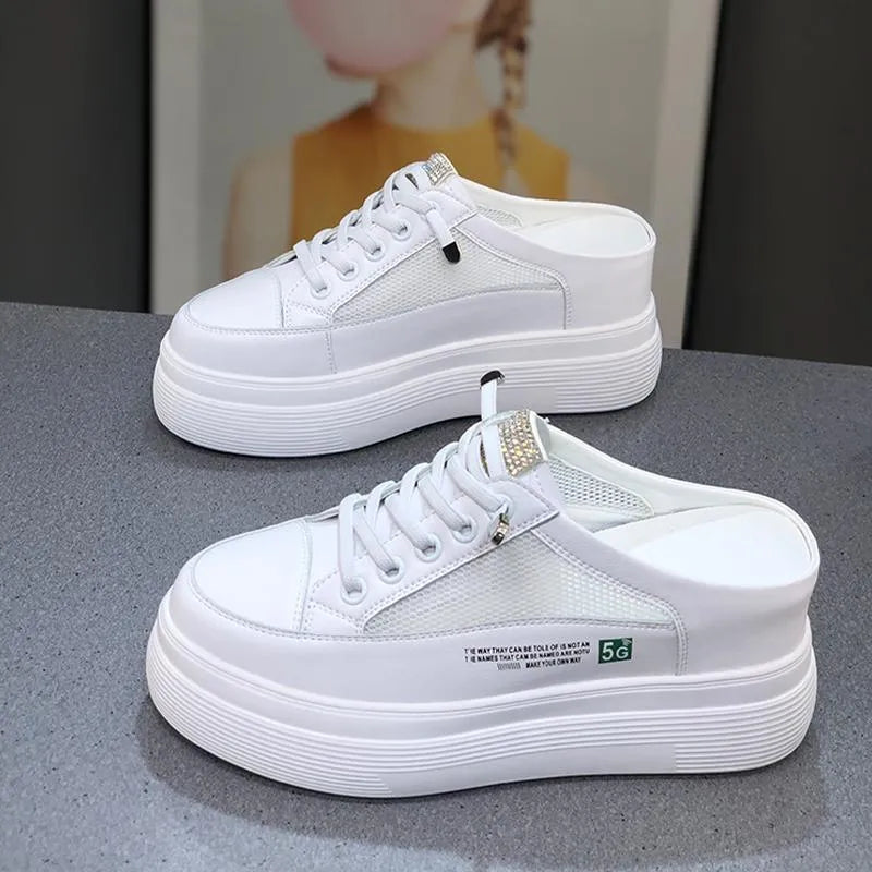 Women's white platform shoes with mesh surface detail and rounded toe