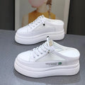 Women's white platform shoes with mesh surface detail and rounded toe