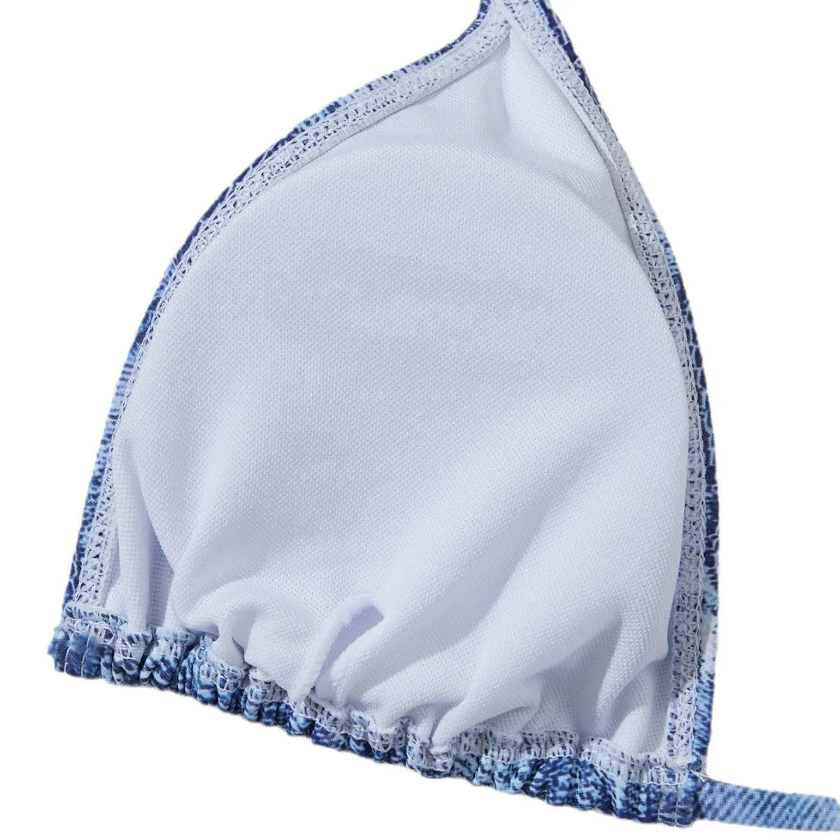 Denim blue printed women's bikini set with strap design, shown on a model.