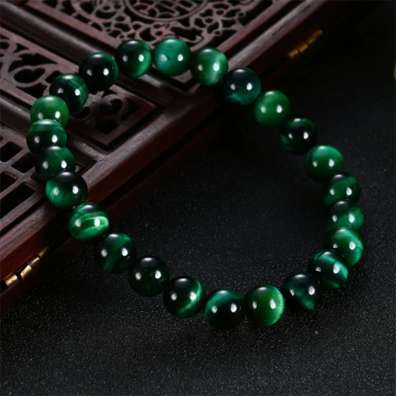 Natural green tiger eye stone bracelet with polished geometric beads in multiple sizes