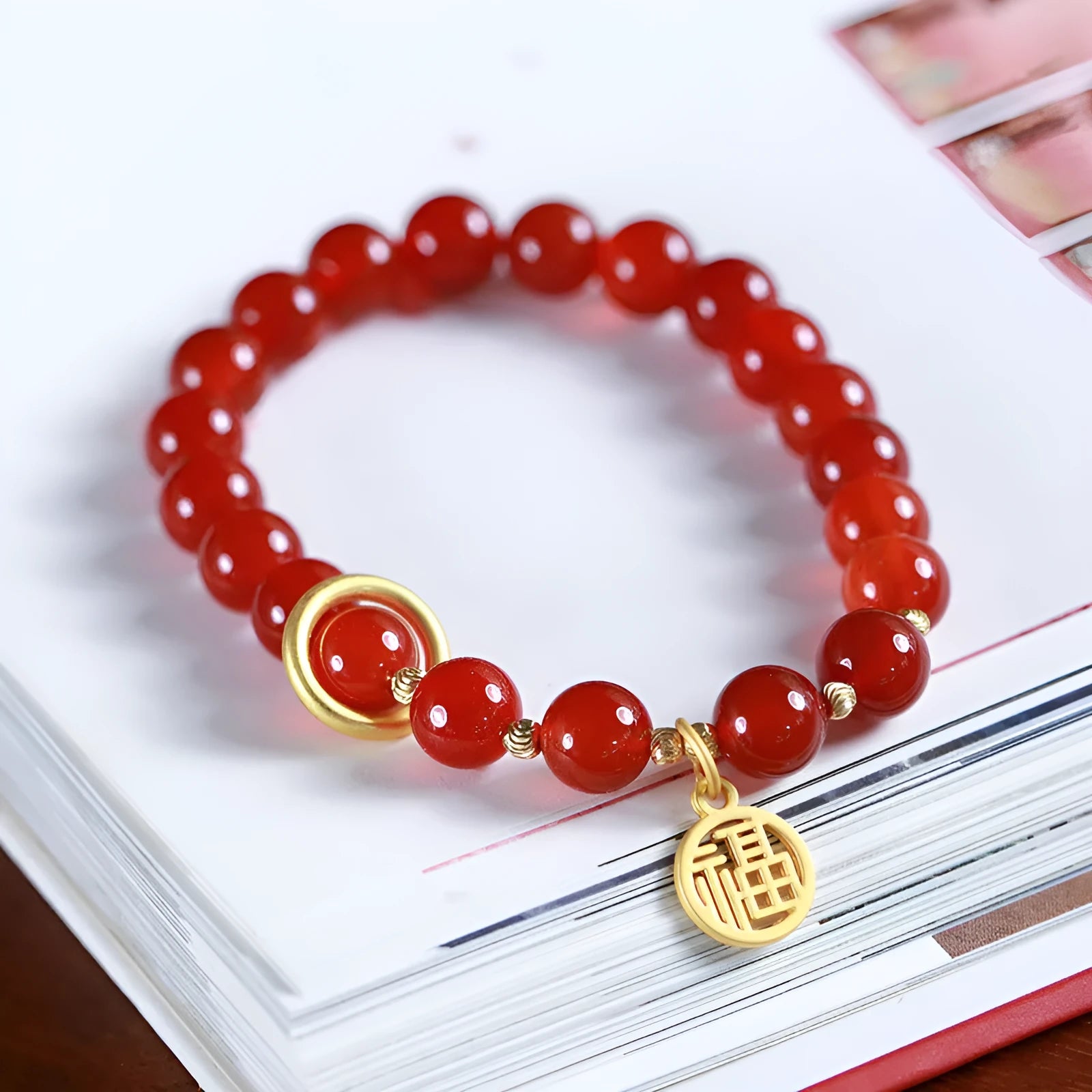 Natural red agate bracelet with hand-woven cord in national style, shown with blessing card.