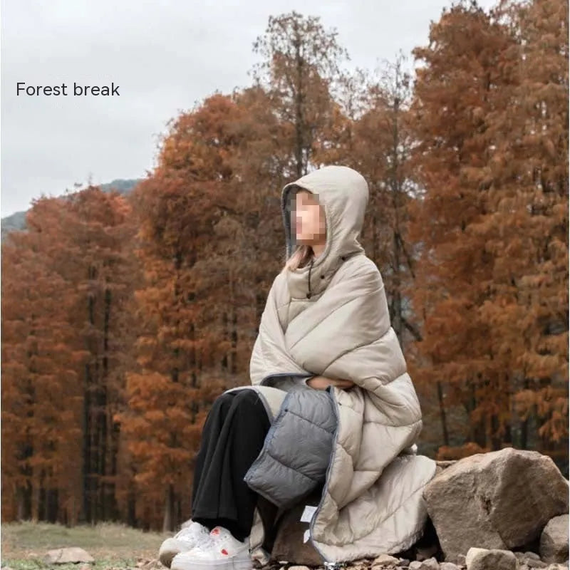 Army Green outdoor cloak sleeping bag worn as a cape, showing its 200x140cm size and nylon fabric.