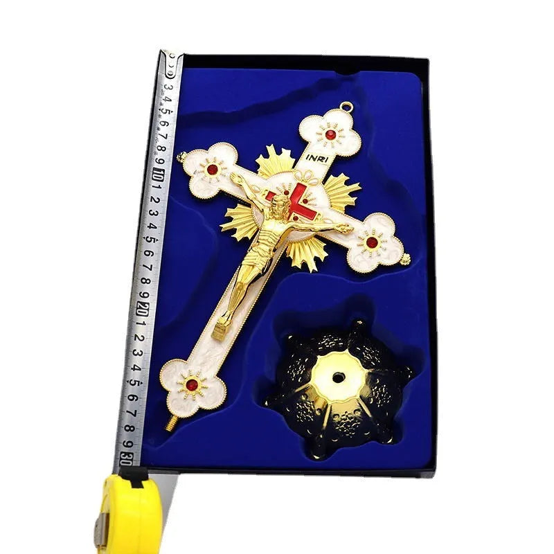Gold geometric zinc alloy car ornament with micro-inlaid design on a desktop.