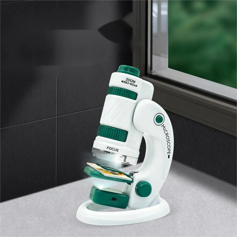 White and green portable microscope set with specimen slides for science education.