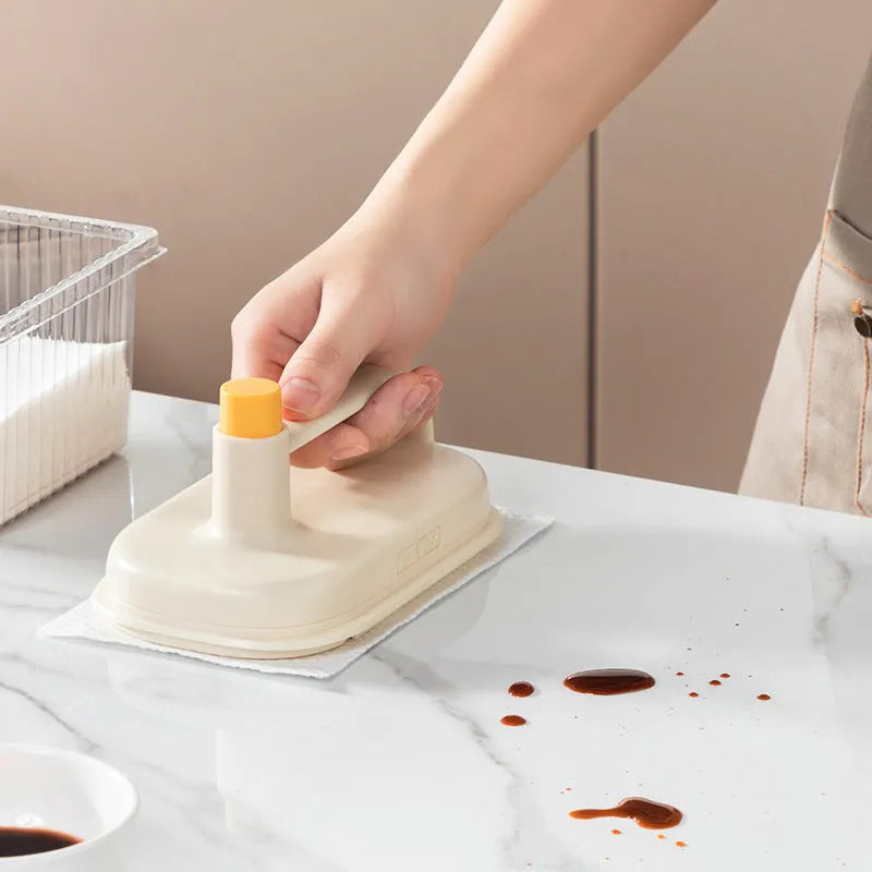 Magic Brush disposable cleaning tool with plastic handle, 50 white non-woven rags, and a storage box holder.