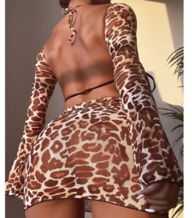 Women's leopard print split bikini swimsuit set with adjustable halter top, high-waisted bottom, and matching skirt