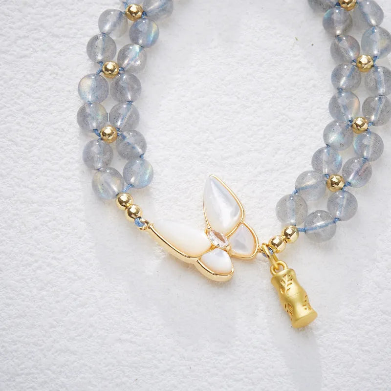 Handwoven women's bracelet with grey moonstone butterfly centrepiece on geometric design