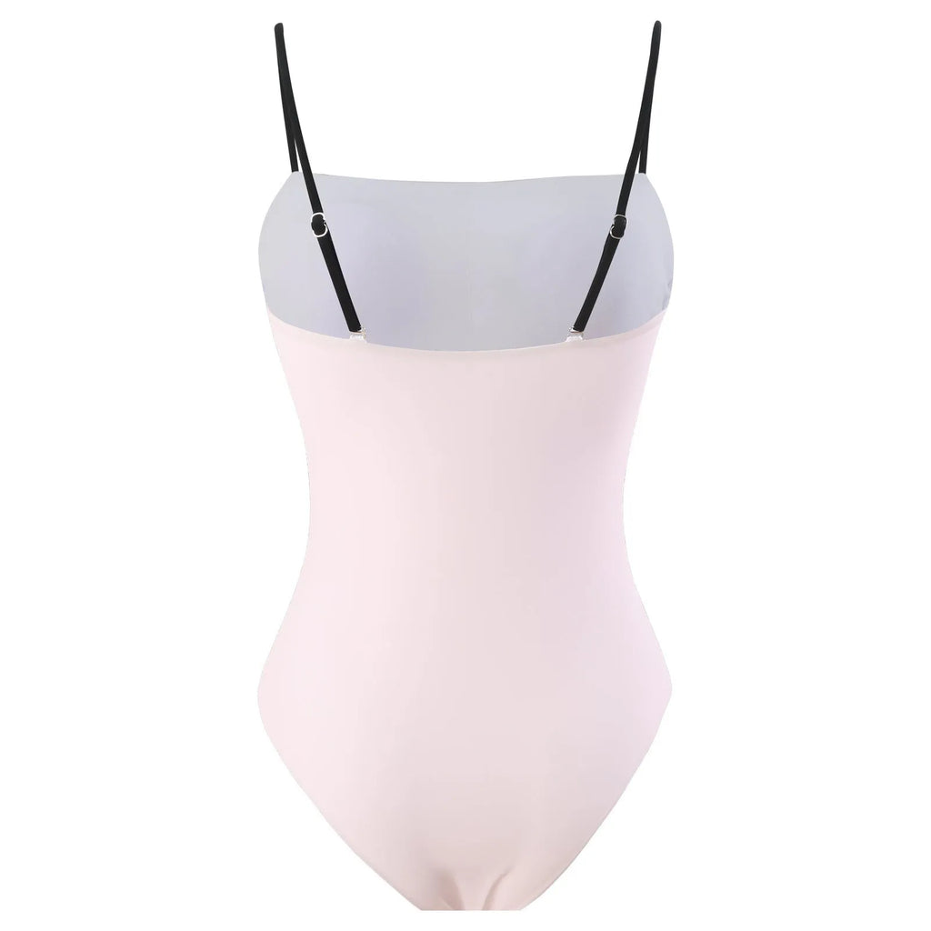 Women's patterned one-piece bikini with a matching lightweight tulle skirt.