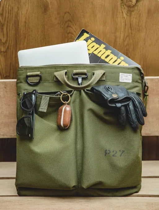 Marden canvas crossbody messenger bag in military green showing laptop compartment and shoulder strap
