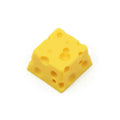 Solid yellow resin artisan key cap with detailed cheese design for MX mechanical keyboards.