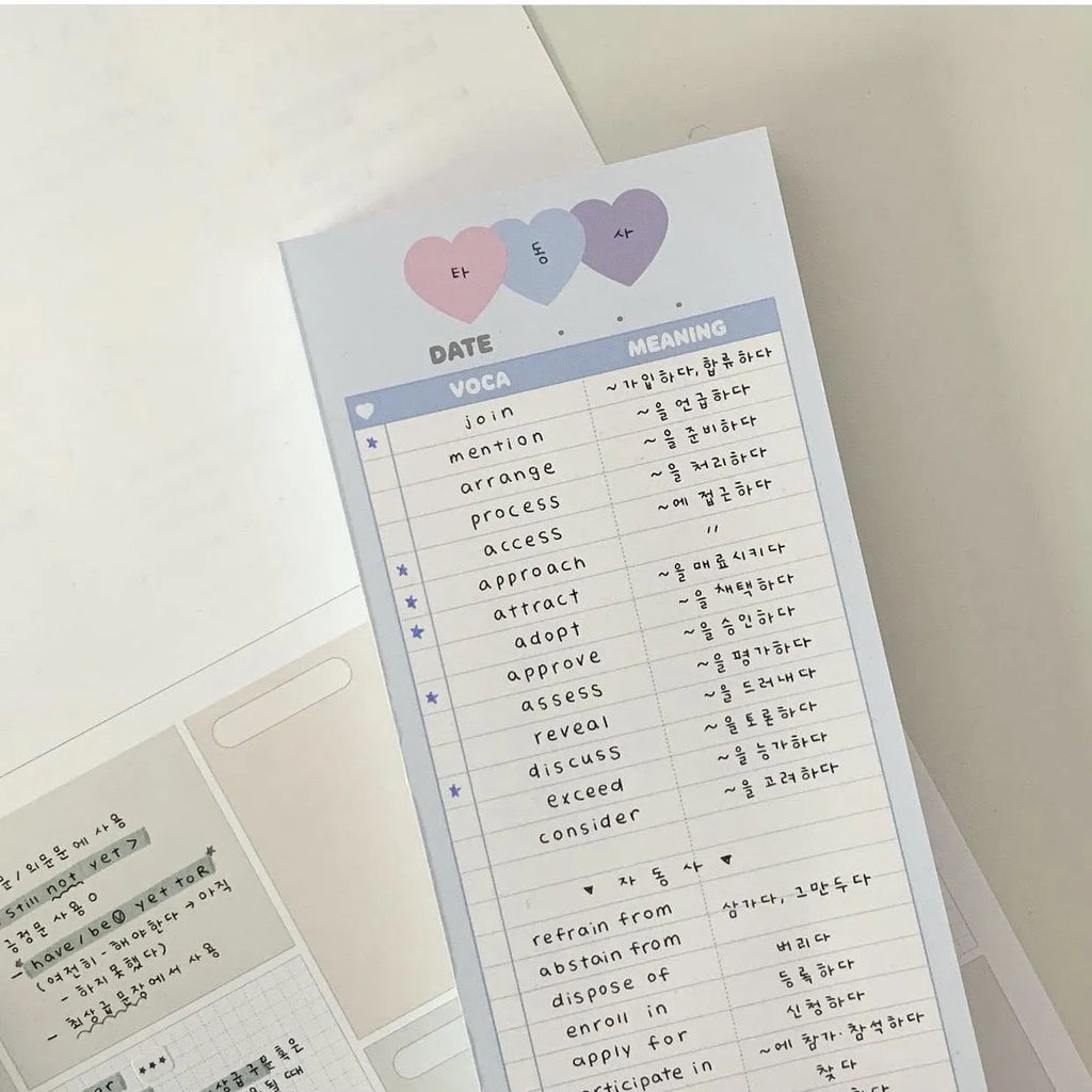 Half-B5 size notepad with English words, shown in pink, purple, and blue cover colour options.