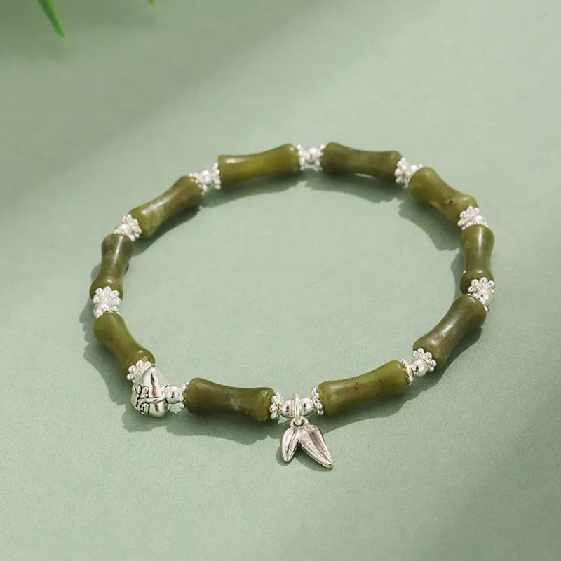 Electroplated bamboo strawberry crystal bracelet for women in green aventurine, showing natural stones on a bracelet.