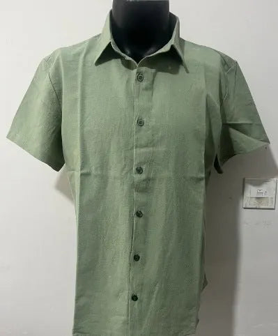 Men's solid colour short sleeve linen blend shirt on a hanger, showing loose fit.