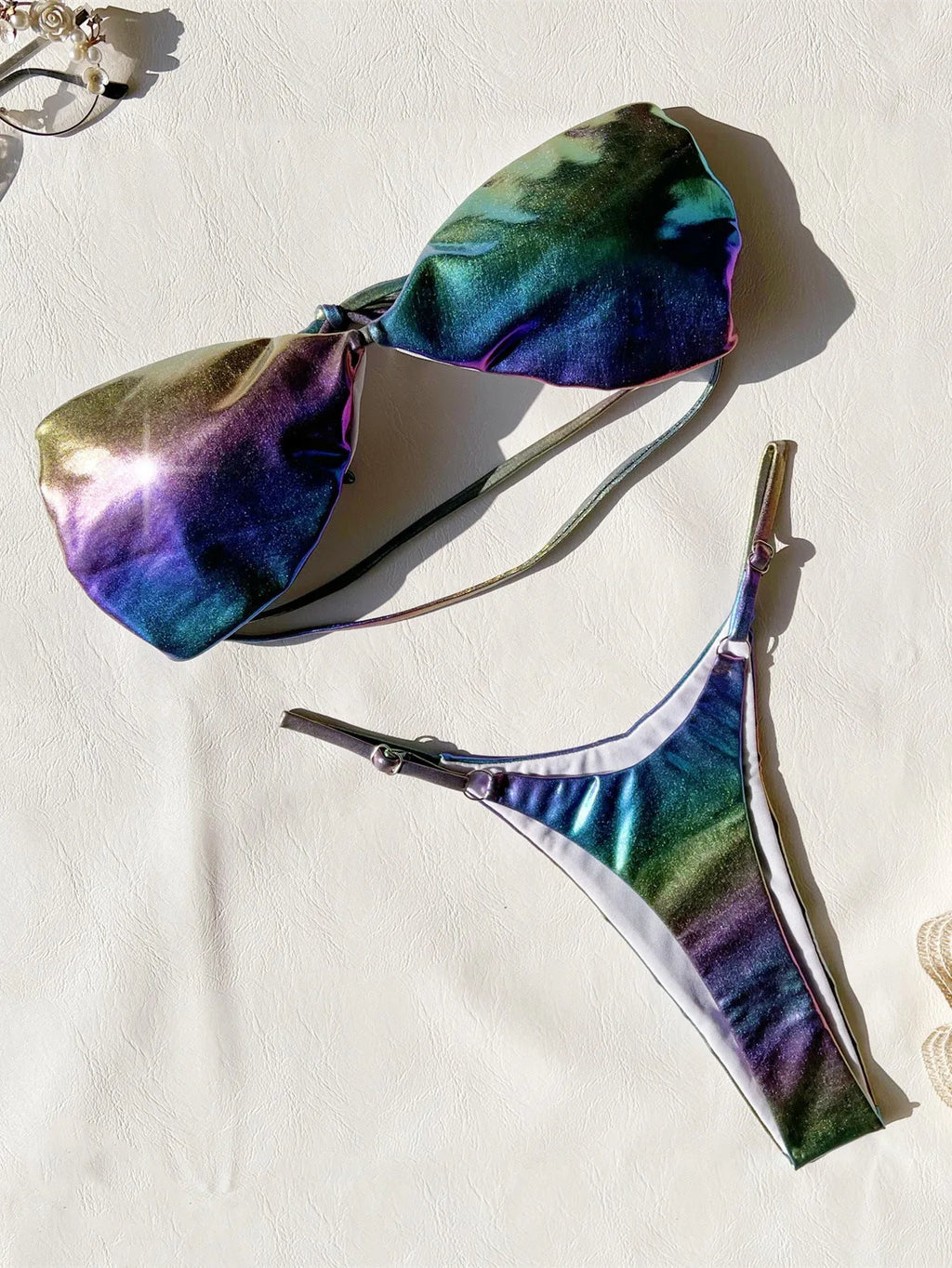 Gradient purple women's bikini swimsuit set on a mannequin.