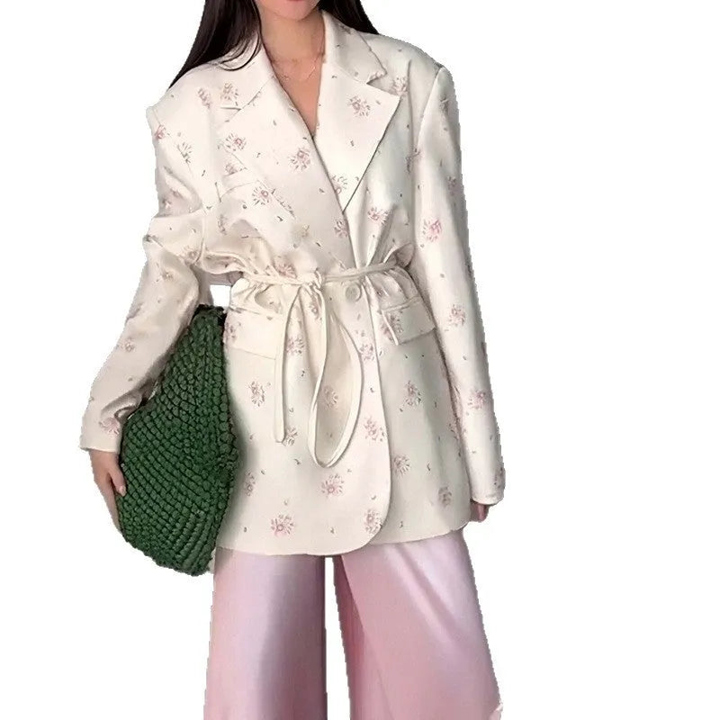Men's collar suit jacket with a lace-up detail at the waist, shown in a floral print colour.