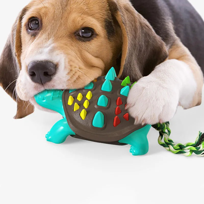 Natural rubber dog toothbrush chew toy with dinosaur design and tug-of-war tail in mint flavour