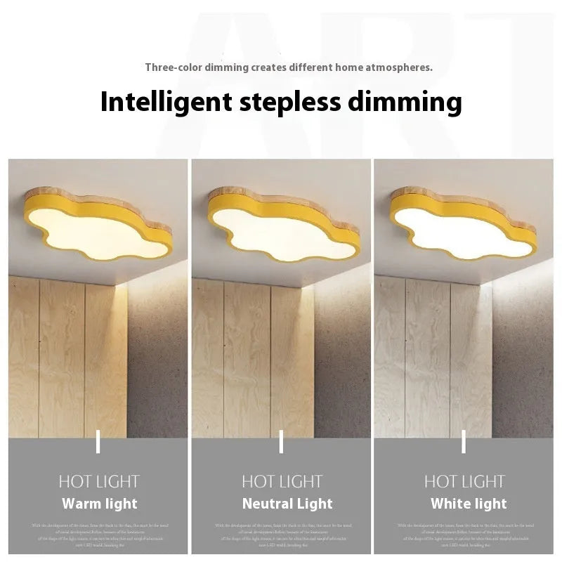Modern cloud-shaped LED ceiling light in a wooden finish, shown in pink, mounted on a ceiling.