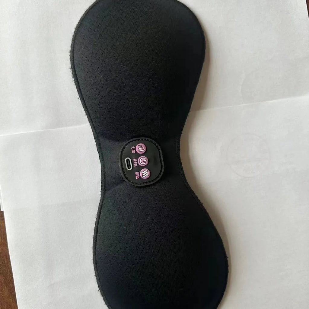 Black adhesive electric chest massage pads with three-key English control unit for hands-free vibration massage.
