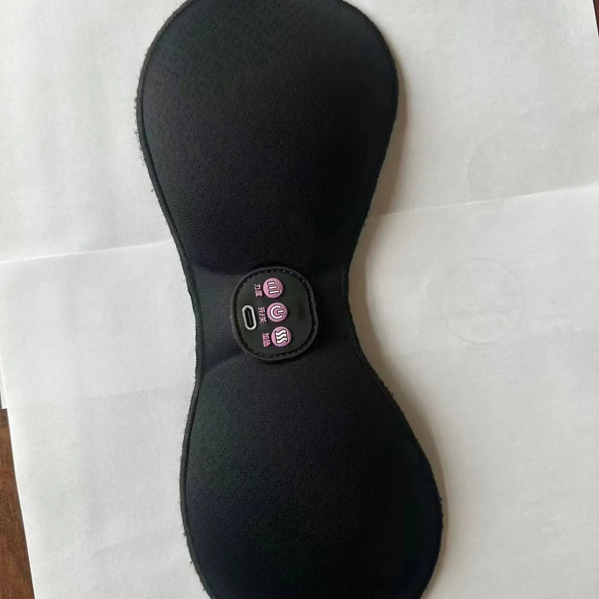 Black adhesive electric chest massage pads with three-key English control unit for hands-free vibration massage.