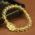 Yellow artificial crystal Pi Xiu bracelet with leather strap in Chinese national style.