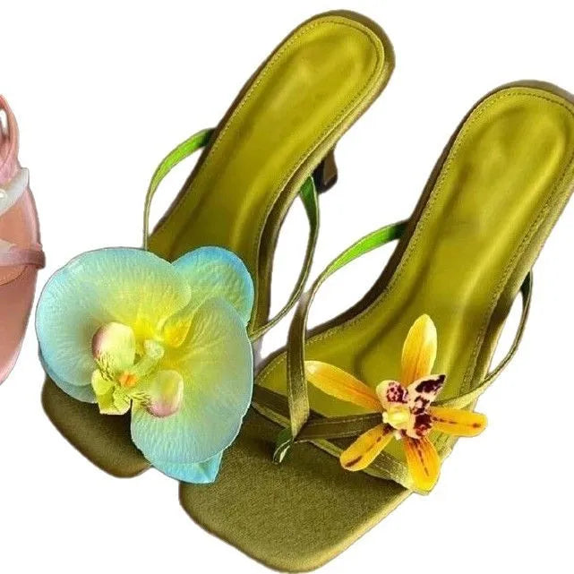 Women's handmade asymmetric flower design sandals in calf leather with a high heel and square toe.
