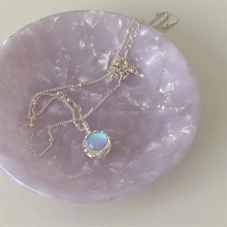 Geometric ornamental stone pendant on a 925 sterling silver curb chain necklace for women.