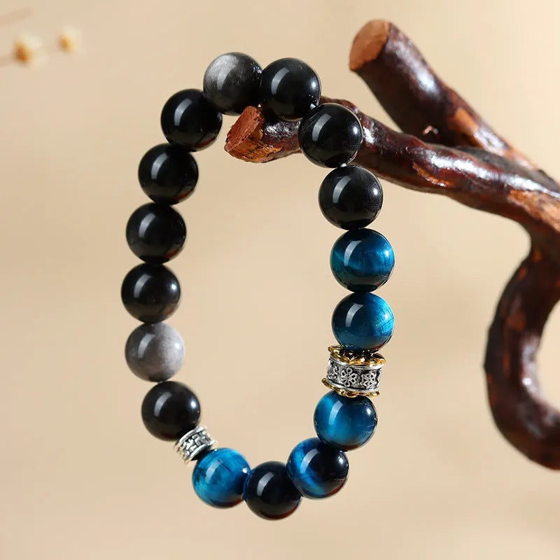 Geometric peacock blue tigereye bracelet with round elements on wrist