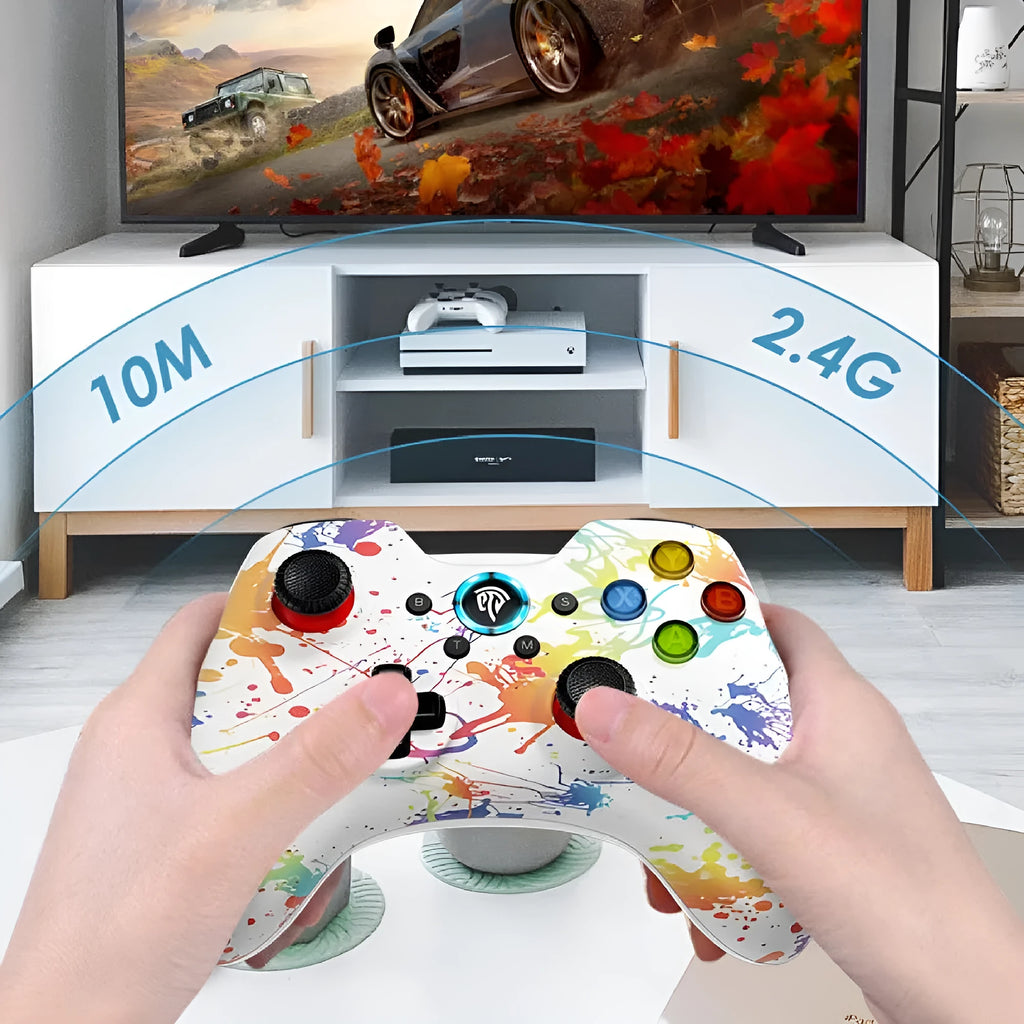 Black dual-mode wireless game controller for PC with coloured action buttons, shown with USB dongle and spare thumbstick caps.