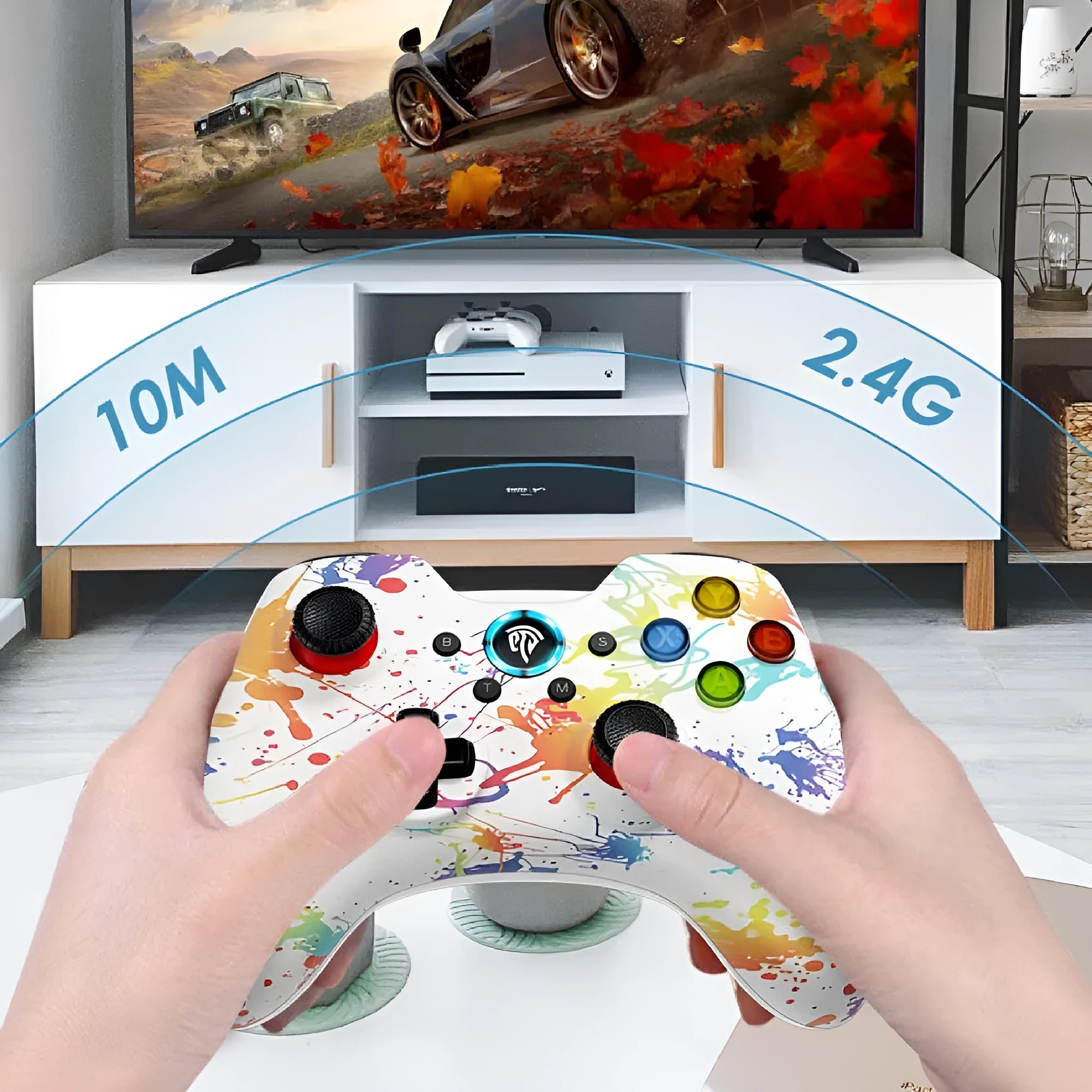 Black dual-mode wireless game controller for PC with coloured action buttons, shown with USB dongle and spare thumbstick caps.
