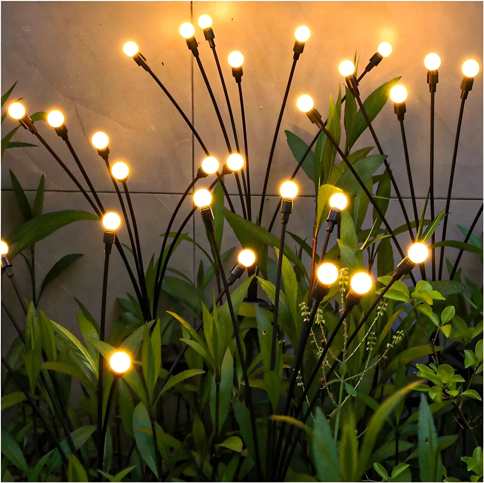 Solar-powered LED garden light with multiple heads on a stainless steel stake, placed in soil.