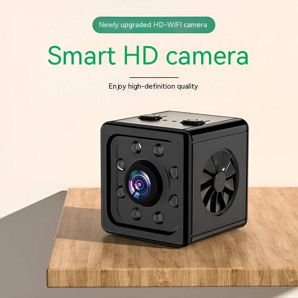 Black cubic network camera on a mounting bracket for indoor HD video monitoring.