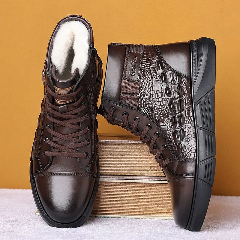 Black genuine leather snow boots with a fur collar, rubber sole, and front laces on a winter background.