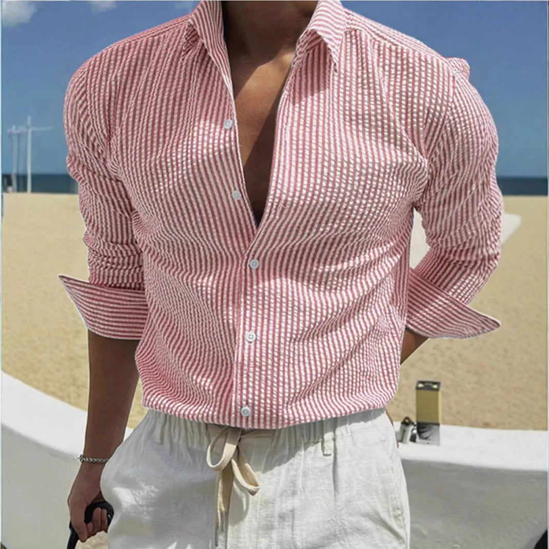 Man's blue and white striped button-up shirt with a lapel collar and long sleeves.