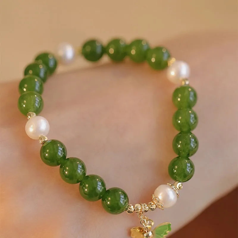 Women's natural green chalcedony bracelet with round geometric beads and handmade craft details