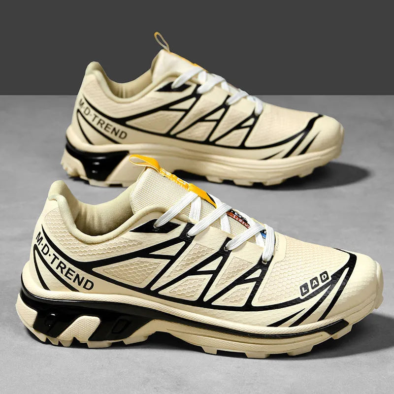 Low-top lace-up hiking shoes in artificial leather with a rubber sole and mesh lining.