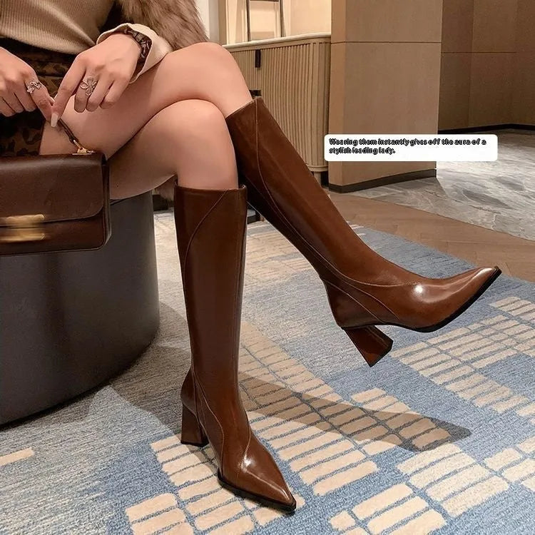 Black retro-style women's high heel riding boots made from cowhide with a waterproof platform.