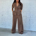 Brown men's slim fit two-piece polyester suit showing top with long sleeves and matching trousers