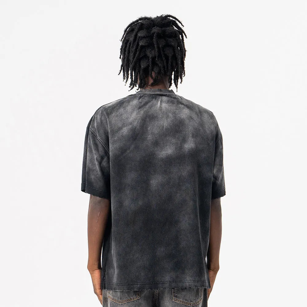 Black men's loose fit cotton T-shirt with printed letter design and drop-shoulder sleeves.